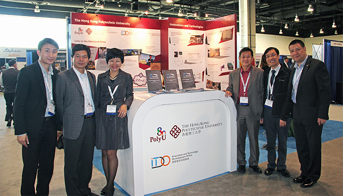 PolyU showcases its latest innovations at the TechConnect World. Professor Daniel S.P. LAU, Head of Department of Applied Physics and Professor H.Y. TAM, Head of Department of Electrical Engineering (2nd & 3rd from right) attend to present their projects.